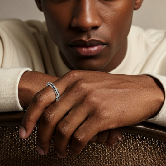 Cool young man wearing handcrafted silver chain ring with edgy, urban style