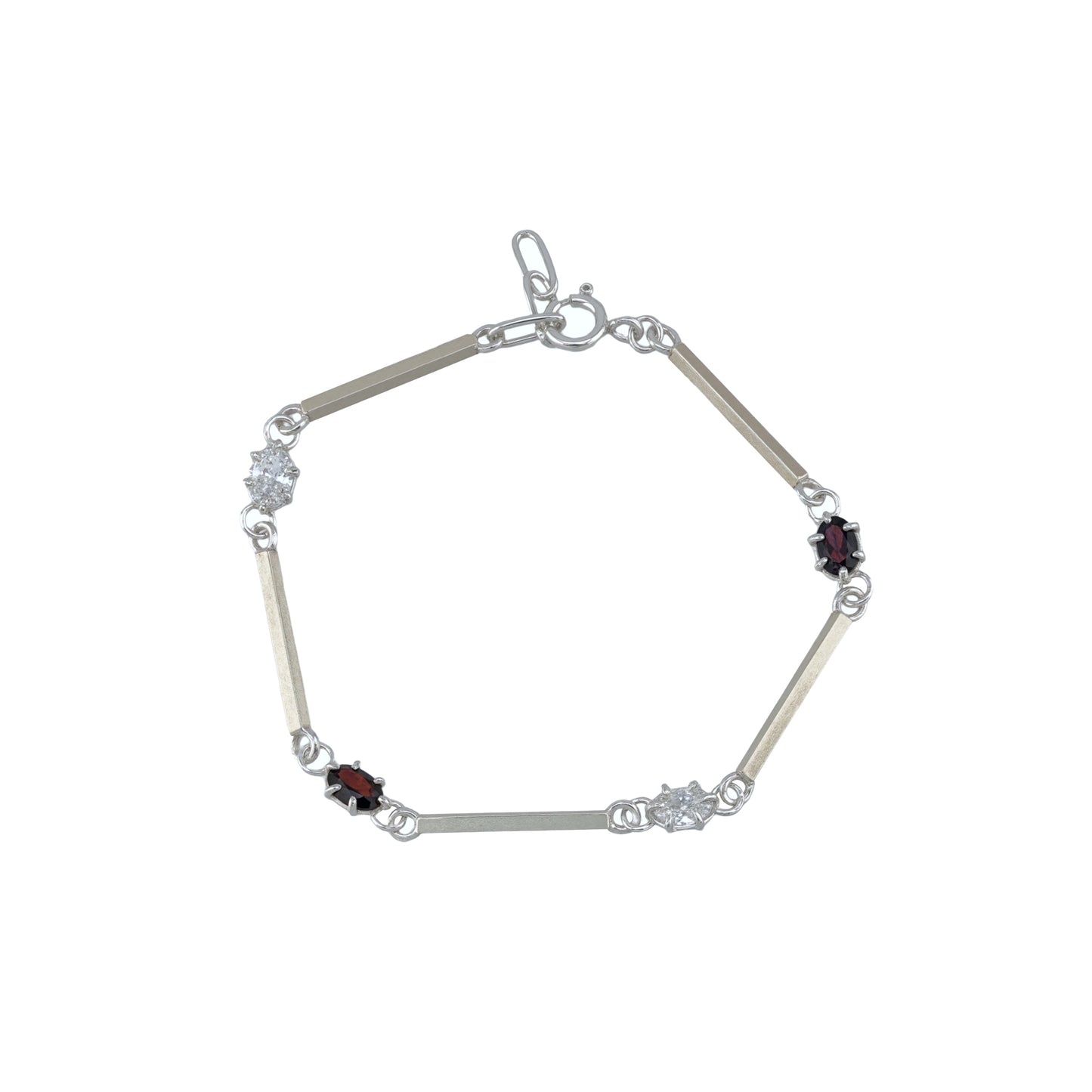Silver bracelet with white and red gemstones on a white background