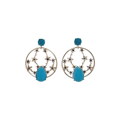 Pair of earrings with blue teardrop-shaped stones on a white background