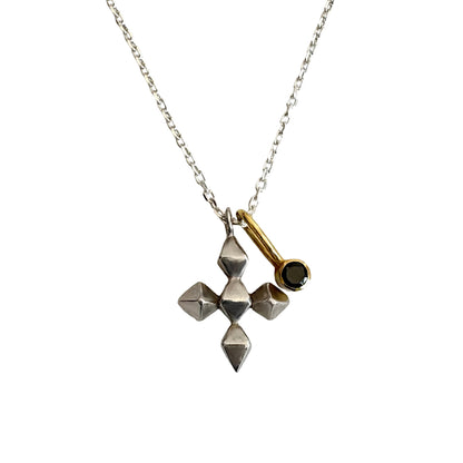 Necklace with geometric pendant and gold accent on a white background