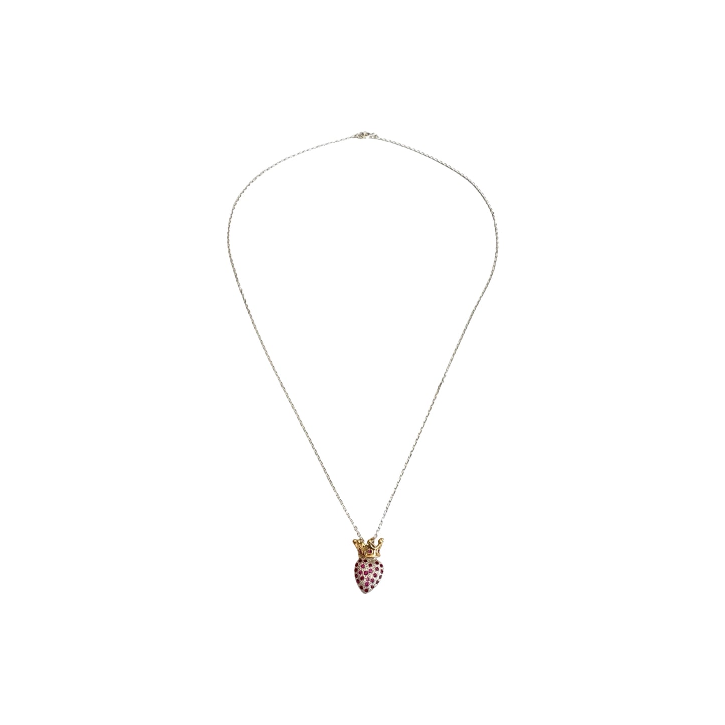 Silver chain with a heart shaped pendant encrusted with red zirconias and golden crown