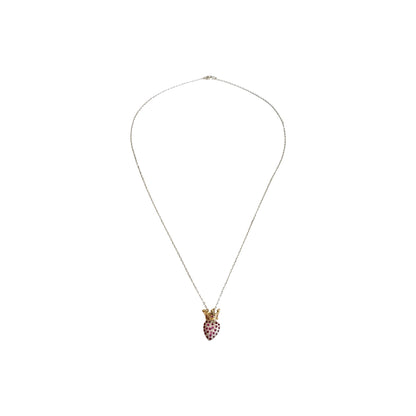 Silver chain with a heart shaped pendant encrusted with red zirconias and golden crown