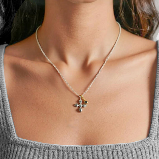 Necklace with a cross pendant with a black stone adding to this unusual jewellery style
