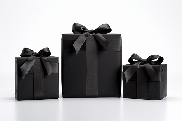 Three black gift boxes of different sizes with a black ribbon and bow on each, presented against a white background.