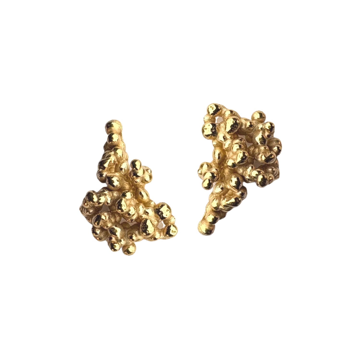 Gold coral-shaped earrings on a white background