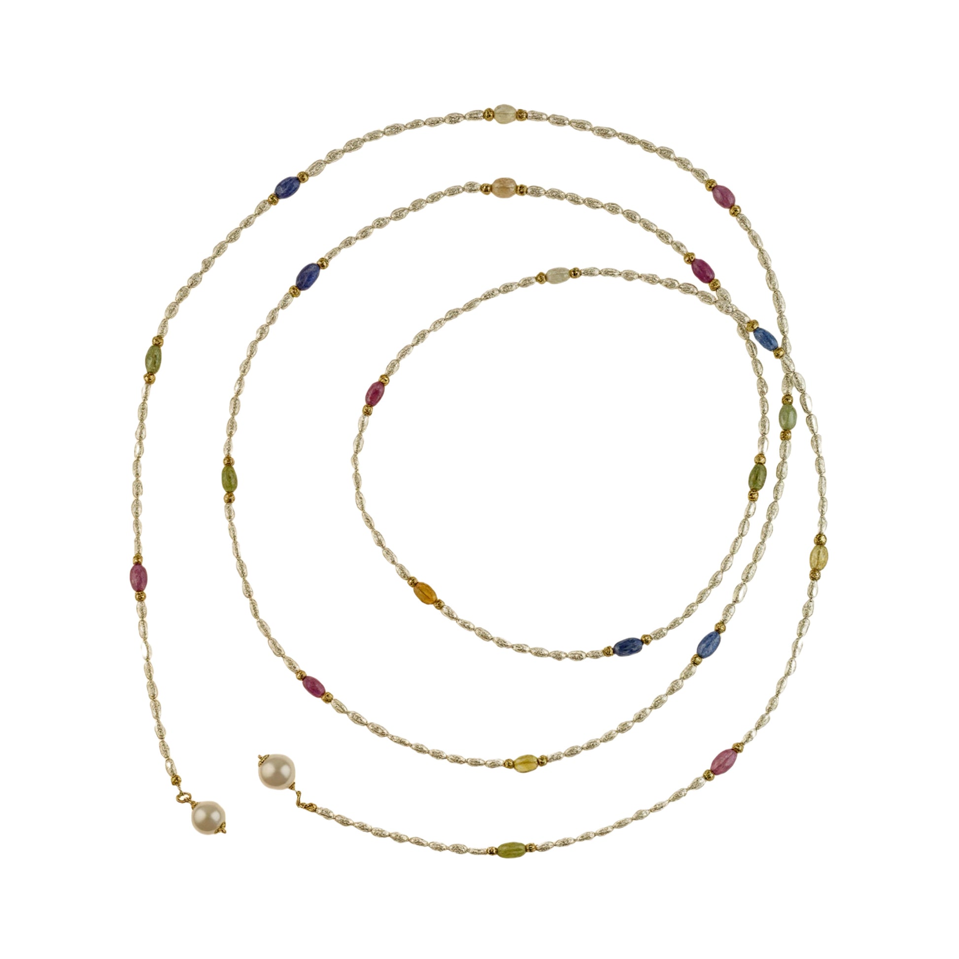 Long pearl necklace with multicolor gemstones and golden separators on a white background
