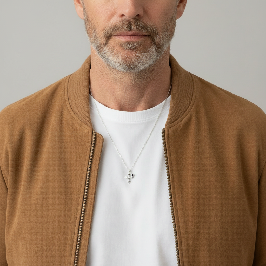 male model wearing a necklace with white t-shirt and camel bomber jacket
