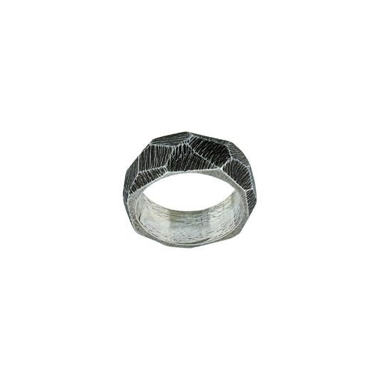 Silver ring with a textured, faceted design on a white background